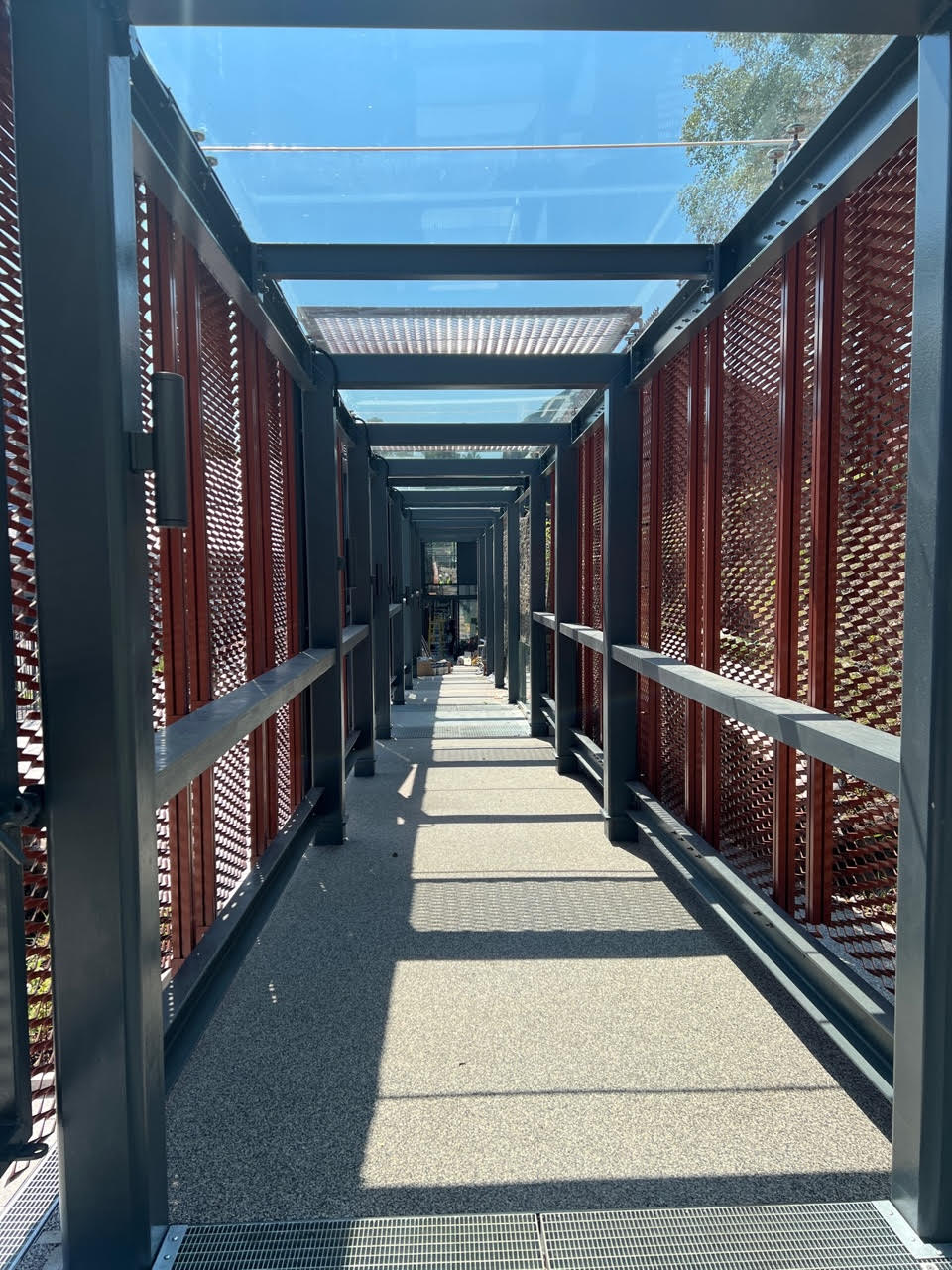 Penderyn Swansea Copperworks Distillery walkway between the Visitor Centre and the Cask Warehouse.